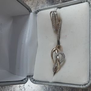 A 10 karat diamond ring and matching pendent